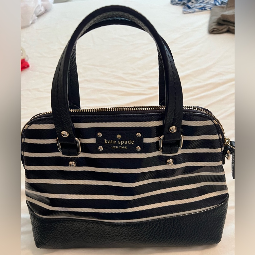Like new Kate Spade handbag. Pristine condition. Navy and white stripe.